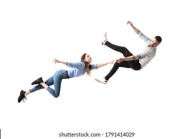 Mid-air beauty cought in moment. Full length shot of attractive young woman and man hovering in air and keeping eyes closed. Levitating in free falling, lack of gravity. Freedom, emotions, artwork - Shutterstock ID 1791414029
