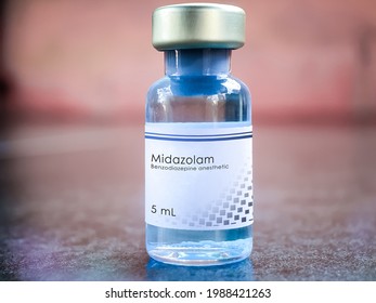 Midazolam medical bottle of benzodiazepine medication used in anesthesia, procedural sedation, trouble sleeping and severe agitation