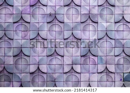 Mid-century modern style tiled wall with half circle decorations, architectural detail design element