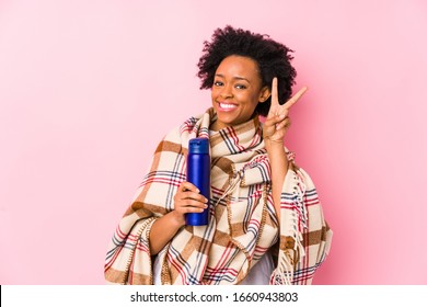 Middle Age African American Woman In A Camping Isolatedshowing Victory Sign And Smiling Broadly.