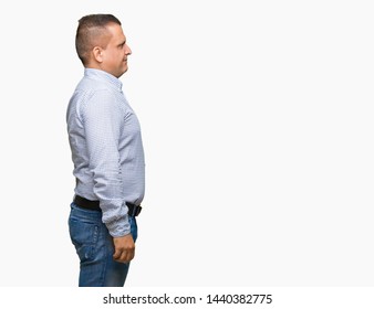 Middle Age Arab Business Man Over Isolated Background Looking To Side, Relax Profile Pose With Natural Face With Confident Smile.