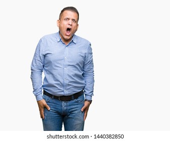 Middle age arab business man over isolated background In shock face, looking skeptical and sarcastic, surprised with open mouth - Shutterstock ID 1440382850