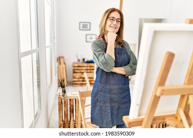 Middle Age Artist Woman Smiling Happy Painting At Art Studio.