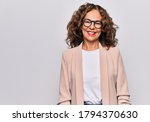 Middle age beautiful businesswoman wearing glasses standing over isolated white background with a happy and cool smile on face. Lucky person.