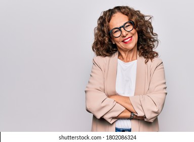 Middle Age Beautiful Businesswoman Wearing Glasses Standing Over Isolated White Background Happy Face Smiling With Crossed Arms Looking At The Camera. Positive Person.