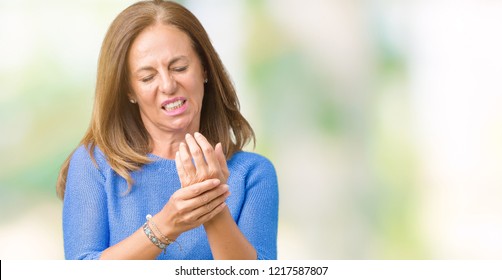 Middle Age Beautiful Woman Wearing Winter Sweater Over Isolated Background Suffering Pain On Hands And Fingers, Arthritis Inflammation