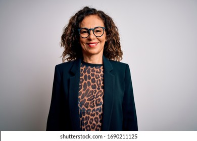 Middle age brunette business woman wearing glasses standing over isolated white background with a happy and cool smile on face. Lucky person.