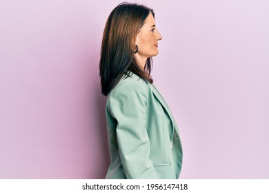 Middle age brunette woman wearing casual clothes looking to side, relax profile pose with natural face and confident smile.  - Powered by Shutterstock