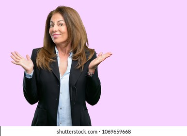 Middle age business woman doubt expression, confuse and wonder concept, uncertain future - Shutterstock ID 1069659668
