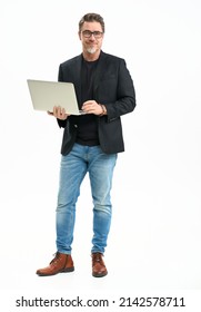 Middle Age Businessman In Business Casual Using Laptop Computer. Entrepreneur In Jeans And Jacket. Mid Adult, Mature Age Man, Happy Smiling. Full Length Portrait Isolated On White.