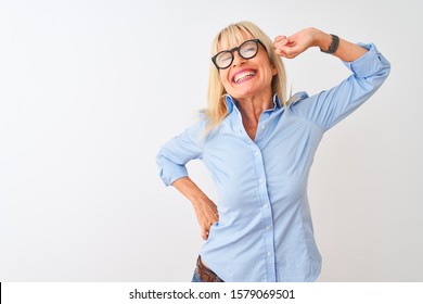 Middle age businesswoman wearing elegant shirt and glasses over isolated white background stretching back, tired and relaxed, sleepy and yawning for early morning - Powered by Shutterstock