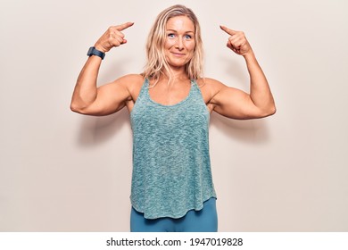 Middle Age Caucasian Blonde Woman Wearing Sportswear Smiling Pointing To Head With Both Hands Finger, Great Idea Or Thought, Good Memory 