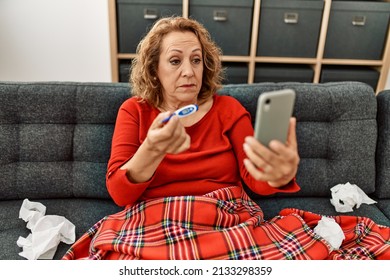 Middle Age Caucasian Illness Woman Having Medical Video Call Sitting On The Sofa At Home.