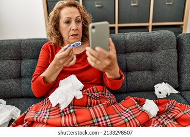 Middle Age Caucasian Illness Woman Having Medical Video Call Sitting On The Sofa At Home.