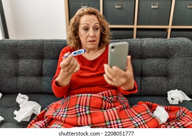 Middle Age Caucasian Illness Woman Having Medical Video Call Sitting On The Sofa At Home.