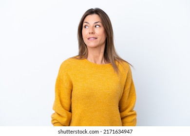 Middle age caucasian woman isolated on white background making doubts gesture looking side - Powered by Shutterstock