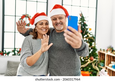 Middle age couple doing video call on christmas - Powered by Shutterstock