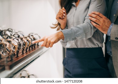 Middle Age Couple Enjoying In Shopping At Modern Jewelry Store. Close Up Shot Of Human Hand Showing At Expensive Watch.