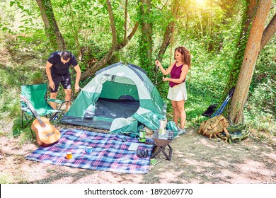 Middle Age Couple Of Hiker Setting Up The Tent To Camping At The Forest