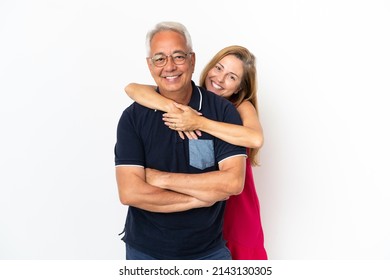 Middle Age Couple Isolated On White Background Laughing And Hugging