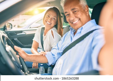 Middle Age Couple In Love Sitting Inside The Car Going For A Trip Taking A Selfie Picture With Smartphone Smiling Happy And Cheerful Together