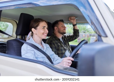 Middle Age Couple Riding In Car, Woman Driver Man In Passenger Seat