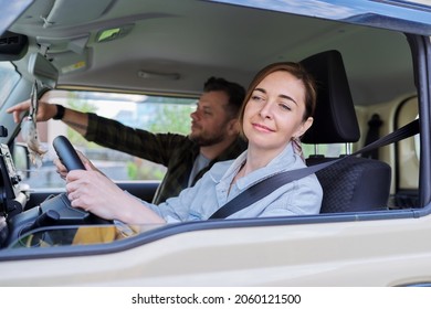 Middle Age Couple Riding In Car, Woman Driver Man In Passenger Seat