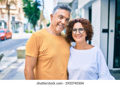 Middle Age Couple Smiling Happy Standing At Street Of City.