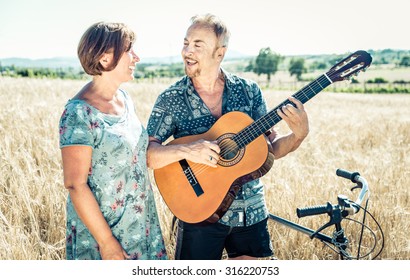 Middle Age Couple Spending The Day In The Countryside And Having Fun. Concept About Seniority And People