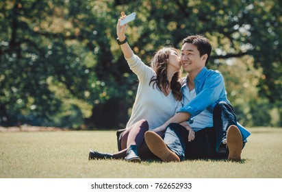 Middle age couple spending time together in Tokyo on a sunny autumn day - Powered by Shutterstock