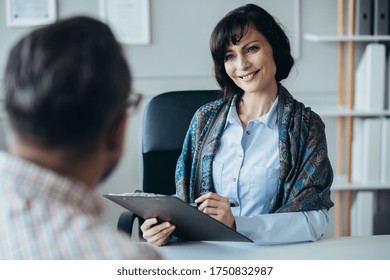 Middle Age Elegant Female Boss During Job Interview With Senior Manager