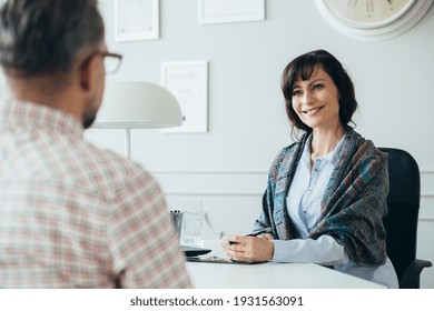 Middle age elegant female boss during job interview with senior manager