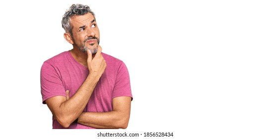 Middle age grey-haired man wearing casual clothes thinking worried about a question, concerned and nervous with hand on chin 