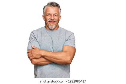 Middle Age Grey-haired Man Wearing Casual Clothes Happy Face Smiling With Crossed Arms Looking At The Camera. Positive Person. 