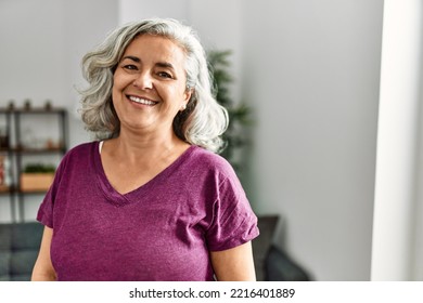 Middle age grey-haired woman smiling happy standing at home. - Powered by Shutterstock