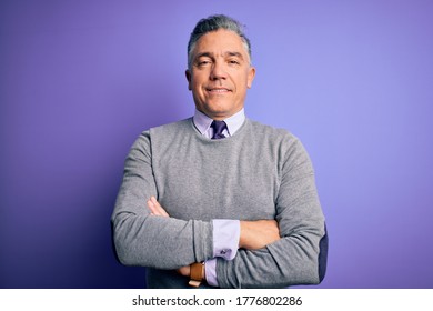 Middle Age Handsome Grey-haired Man Wearing Elegant Sweater Over Purple Background Happy Face Smiling With Crossed Arms Looking At The Camera. Positive Person.