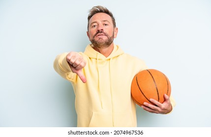 Middle Age Handsome Man Feeling Cross,showing Thumbs Down. Basketball Concept