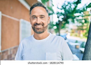 Middle Age Handsome Man Smiling Happy Looking To The Camera At The City.