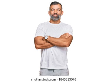 Middle Age Handsome Man Wearing Casual White Tshirt Happy Face Smiling With Crossed Arms Looking At The Camera. Positive Person. 