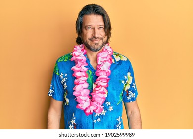 Middle Age Handsome Man Wearing Summer Shirt And Hawaiian Lei With A Happy And Cool Smile On Face. Lucky Person. 