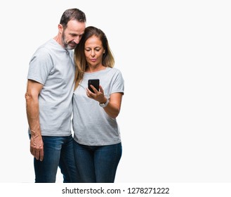 Middle Age Hispanic Couple Texting Message On Smartphone Ver Isolated Background With A Confident Expression On Smart Face Thinking Serious