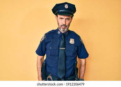 Middle Age Hispanic Man Wearing Police Uniform Depressed And Worry For Distress, Crying Angry And Afraid. Sad Expression. 