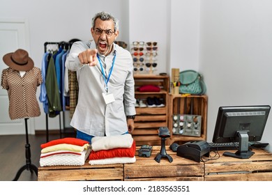 Middle Age Hispanic Man Working As Manager At Retail Boutique Pointing Displeased And Frustrated To The Camera, Angry And Furious With You 