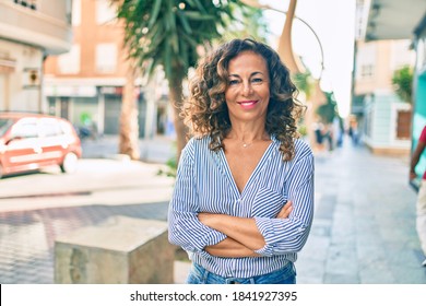 Middle Age Hispanic Woman Smiling Happy Walking At The City.