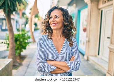 Middle Age Hispanic Woman Smiling Happy Walking At The City.