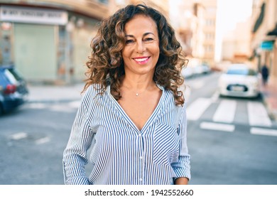 Middle Age Hispanic Woman Smiling Happy Walking At The City.