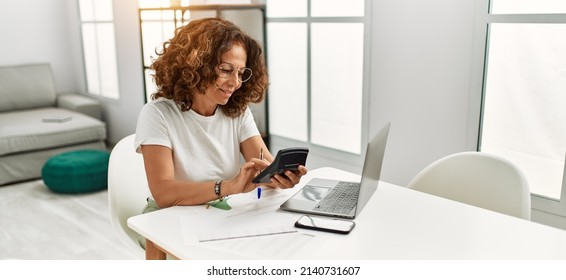 Middle Age Hispanic Woman Smiling Confident Working At Home