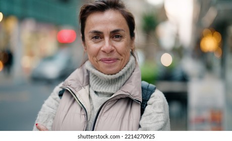 Middle Age Hispanic Woman Smiling Confident Standing At Street