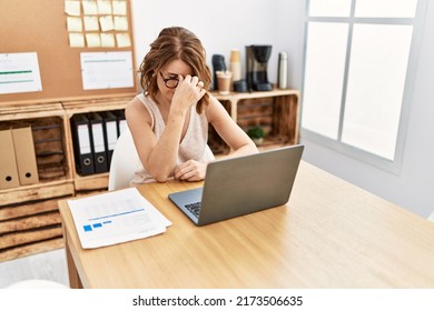 Middle Age Hispanic Woman Stressed Working At Office