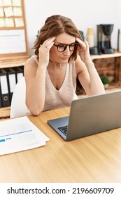 Middle Age Hispanic Woman Stressed Working At Office